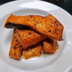 smoked spring salmon sticks that are peppered